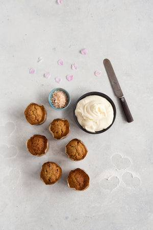 
                  
                    Load image into Gallery viewer, top view 6 gluten free plain carrot cupcakes shown with bowl cream cheese frosting
                  
                