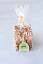 package of 6 gluten free almond orange biscotti in compostable cellulose bag with ribbon and Origin Bakery sticker