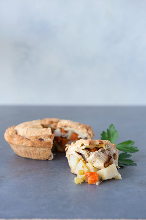 
                  
                    Load image into Gallery viewer, gluten free chicken pot pie, with piece cut out displayed in front
                  
                