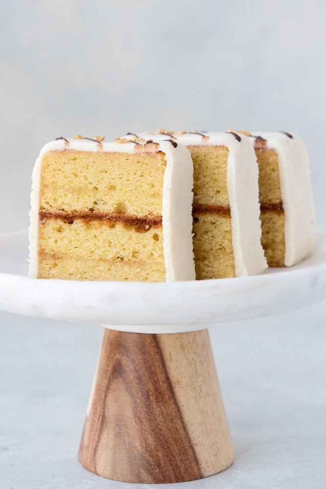 3 slices gluten free almond pound cake with marzipan on cake stand