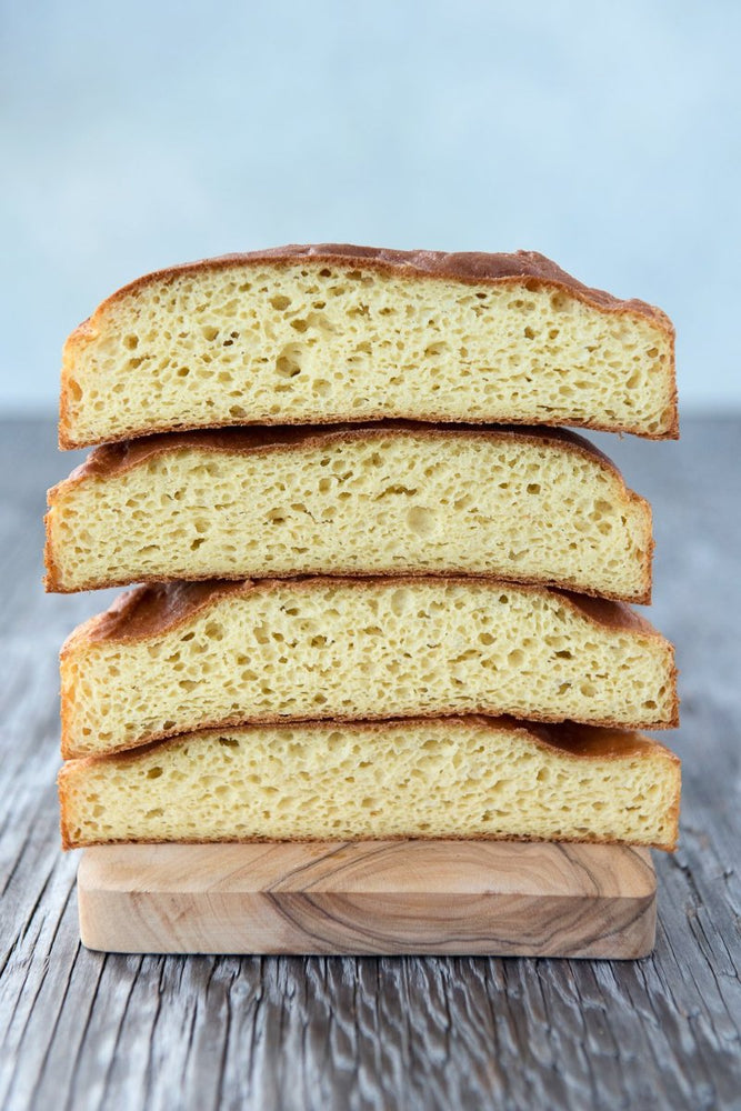 
                  
                    Load image into Gallery viewer, cut faces vertical stack 4 gluten free focaccia bread rounds
                  
                