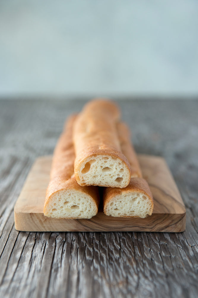 3 gluten free baguettes cut face on cutting board