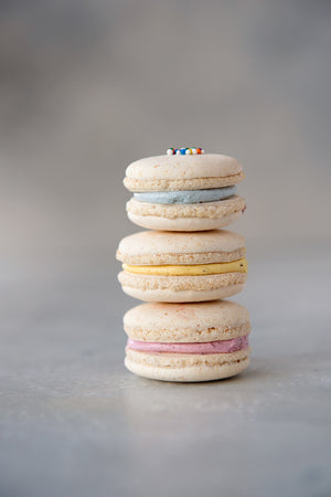 
                  
                    Load image into Gallery viewer, stack of 3 gluten free macarons, buttercream filling, blue, yellow, pink
                  
                