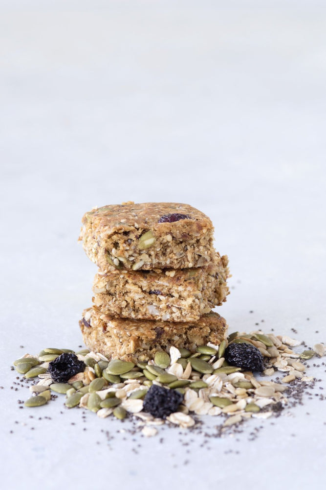
                  
                    Load image into Gallery viewer, stack 3 gluten free granola bar squares displayed with raisins sunflower seeds oats and poppy seeds
                  
                