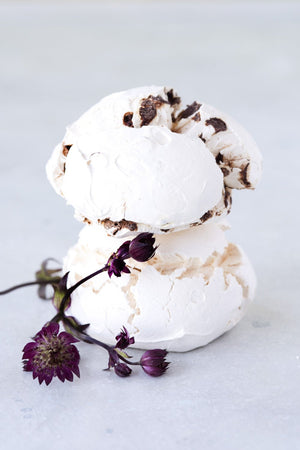 
                  
                    Load image into Gallery viewer, stack 2 large chocolate chip meringues shown with purple flowers
                  
                