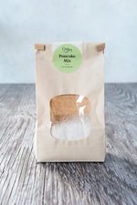 gluten free pancake mix in paper window tin tie bag with Origin Bakery sticker