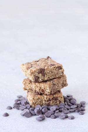 
                  
                    Load image into Gallery viewer, stack of 3 gluten free vegan chocolate chip cookie bars shown with Michel Cluizel soy-free dark chocolate chips
                  
                
